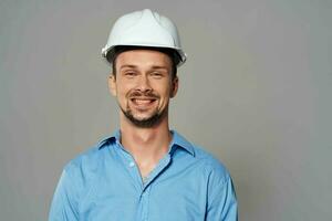 Cheerful male engineer construction helmet on his head safety work photo