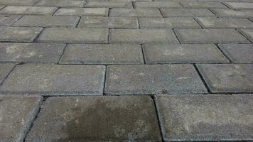 surface of paving block bricks on the pavement photo