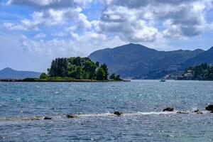 Pontikonis or Mouse island off the coast of Corfu, Greece photo