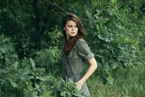 Woman in the forest Green jumpsuit attractive look nature photo