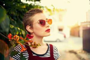 woman wearing sunglasses flowers firing fresh air photo