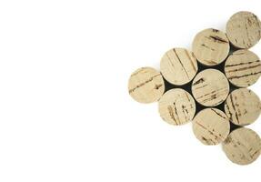 Triangle of corks isolated on a white background shot from above. photo