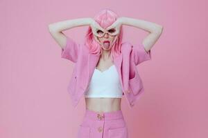 Beauty Fashion woman gestures with his hands with a pink jacket color background unaltered photo