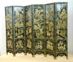 Ancient chinese screen with golden details on a black background photo