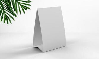 A white paper Table Tent rendered in an elegant setting featuring green plan leaves and Copy Space for mockups. 3D Render Illustration. photo