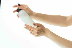 woman with lotion in hands skin care cosmetology moisturizing photo