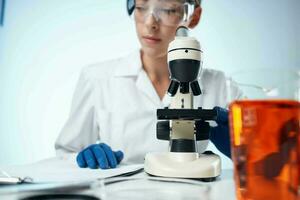 female doctor biology technology research microscope photo