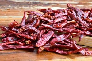 Isolated asian dry red chillies on a white background photo