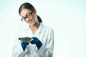 female student agronomist biotechnology plants experiment photo