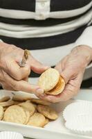 Filling cookies with caramelised milk photo