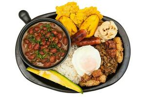 Traditional Colombian dish called Banda paisa a plate typical of Medellin that includes meat, beans, egg and plantain photo