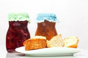 Homemade jams and bread photo