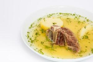 Traditional Colombian beef rib broth isolated on white background photo