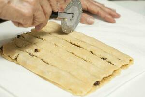 Cutting coconut filled sticks photo