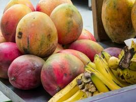 Street sell of fresh topical mango at Cali city center photo