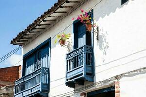 Beautiful balconies of the colonial houses at the small town of Santa Fe de Antioquia in Colombia photo