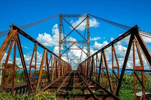 Abandoned bridge between Roldanillo and Zarzal at the region of Valle del Cauca in Colombia photo