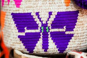 Traditional bags hand knitted by women of the Wayuu community photo