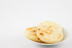 Roasted traditional Colombian white corn arepa photo