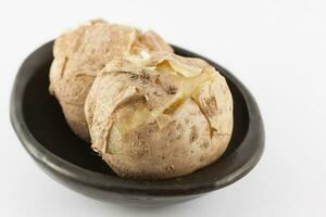 Traditional Colombian cooked potatoes called papas saladas isolated on white background photo