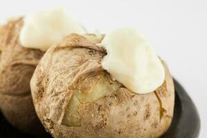 Traditional Colombian cooked potatoes called papas saladas topped with mayonnaise isolated on white background photo