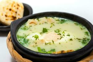 Traditional Colombian Poached Egg Soup called changua photo