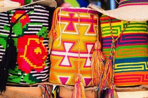 Traditional bags hand knitted by women of the Wayuu community photo