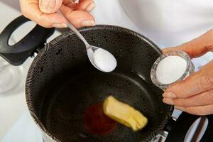 Preparation of the traditional dish from the Caribbean Coast in colombia called Arepa de Huevo or egg arepa photo