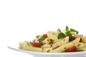 Penne rigate with cherry tomatoes and black pepper photo