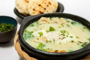 Traditional Colombian Poached Egg Soup called changua photo