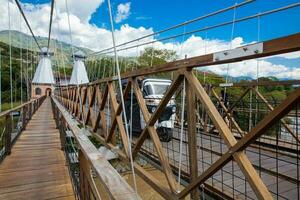 The historical Bridge of the West a a suspension bridge declared Colombian National Monument built in 1887 over the Cauca River photo