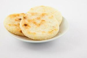 Roasted traditional Colombian white corn arepa photo