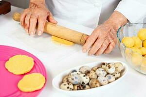 Preparation of the traditional dish from the Caribbean Coast in colombia called Arepa de Huevo or egg arepa photo