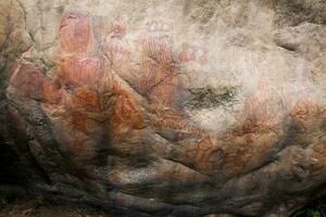 Prehistoric paintings on rock known as petroglyphs in Colombia photo