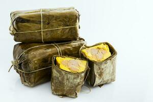 Traditional Colombian tamale as made on Santander region isolated on white background photo