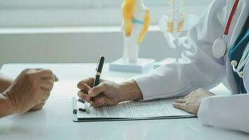 Male patient having consultation with doctor or psychiatrist who working on diagnostic examination on men's health disease or mental illness in medical clinic or hospital mental health service center video