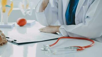 Male patient having consultation with doctor or psychiatrist who working on diagnostic examination on men's health disease or mental illness in medical clinic or hospital mental health service center video