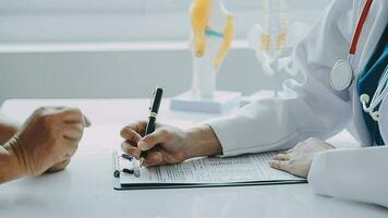 Male patient having consultation with doctor or psychiatrist who working on diagnostic examination on men's health disease or mental illness in medical clinic or hospital mental health service center video