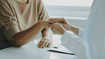 Male patient having consultation with doctor or psychiatrist who working on diagnostic examination on men's health disease or mental illness in medical clinic or hospital mental health service center video