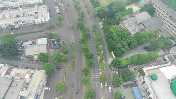 4K footage aerial view of the Kota Wisata highway when it's a bit foggy and overcast during the day. video