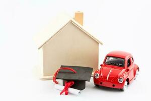 Financial life goals concept. Car, house and scholarship isolated on white background photo