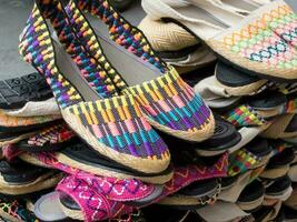 Street sell of traditional espadrilles at Cali city center photo