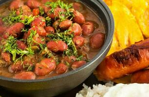 Traditional Colombian dish called Banda paisa a plate typical of Medellin that includes meat, beans, egg and plantain photo