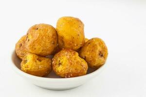 Fried yellow potato isolated in white background. Solanum phureja photo