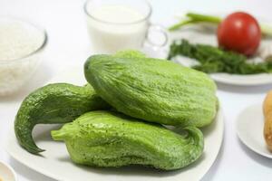 Ingredients to prepare stuffed cucumbers photo