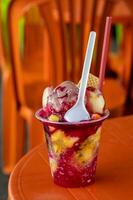 Traditional sweet water ice with fruits called cholado in the city of Cali in Colombia photo