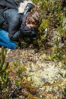 Young woman exploring the nature of a beautiful paramo at the department of Cundinamarca in Colombia photo