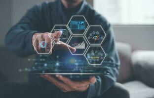 investment trends data analysis concept, businessman using computer tablet with virtual data charts, technology transformation ai technology trading photo