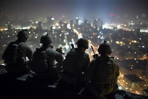 Back of group soldiers sit on roof of night big city. Special forces. . photo