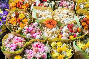 Vintage flowers market on public street - retro cottagecore style. photo